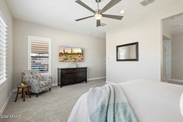 bedroom with ceiling fan and light colored carpet