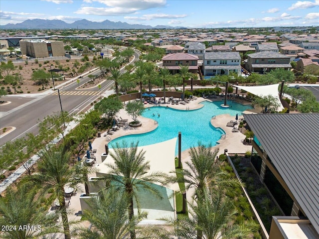 view of pool featuring a mountain view and a patio area