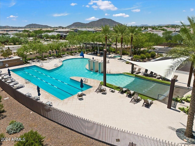 view of pool with a mountain view and a patio