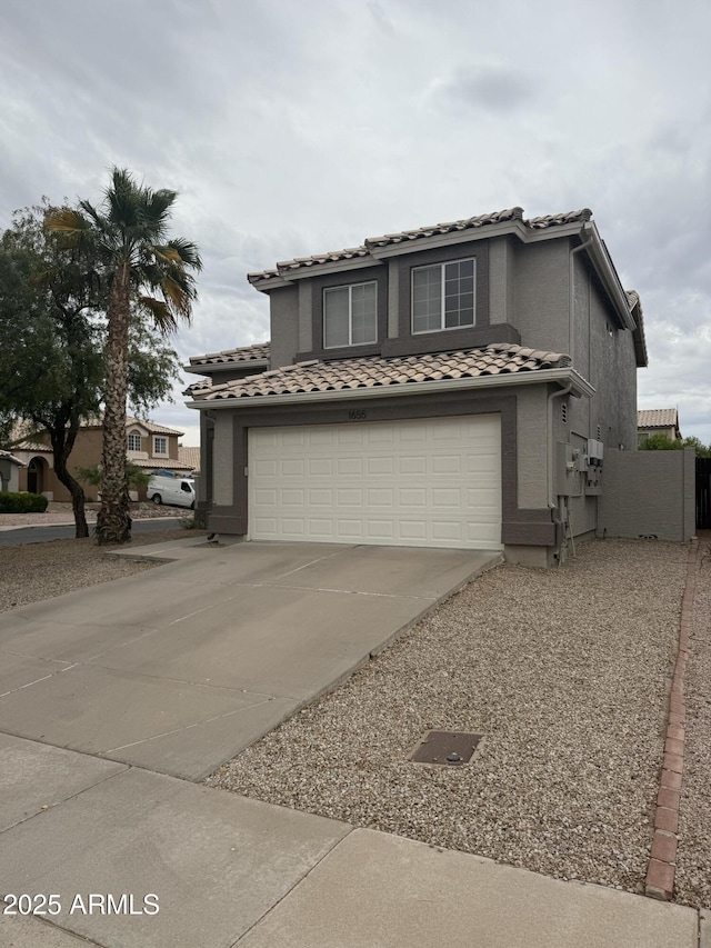 1655 W Stanford Ave, Gilbert, AZ 85233 - mediterranean / spanish-style home with a tiled roof, an attached garage, and driveway