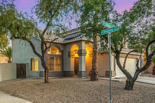 1655 W Stanford Ave, Gilbert, AZ 85233 - mediterranean / spanish-style house with stucco siding and a garage