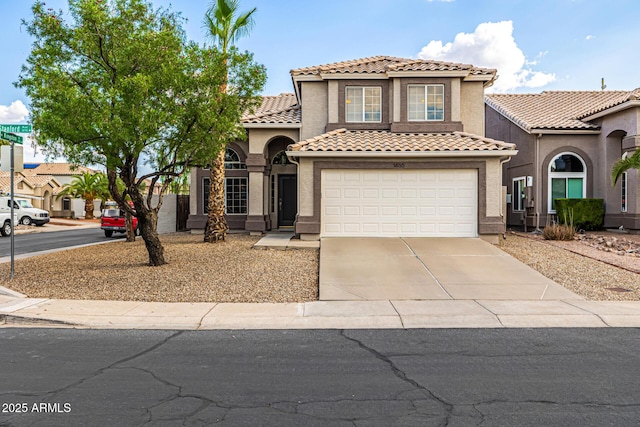 1655 W Stanford Ave, Gilbert, AZ 85233 - mediterranean / spanish home with concrete driveway, a tile roof, stucco siding, and a garage