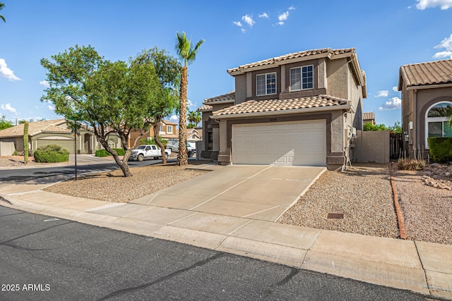 1655 W Stanford Ave, Gilbert, AZ 85233 - mediterranean / spanish-style house featuring a tiled roof, a garage, concrete driveway, and stucco siding