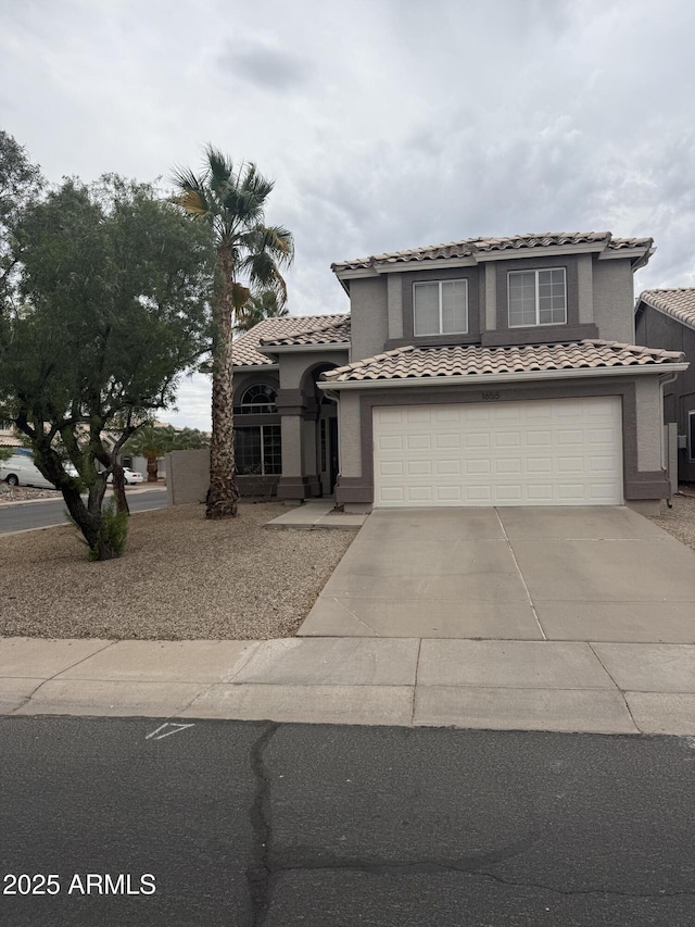 1655 W Stanford Ave, Gilbert, AZ 85233 - mediterranean / spanish house featuring concrete driveway, a tile roof, a garage, and stucco siding