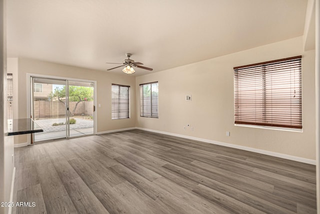 1655 W Stanford Ave, Gilbert, AZ 85233 - empty room featuring baseboards, ceiling fan, and wood finished floors