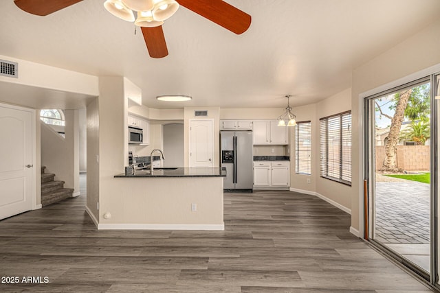 1655 W Stanford Ave, Gilbert, AZ 85233 - kitchen featuring stainless steel appliances, a ceiling fan, dark countertops, white cabinets, and a sink