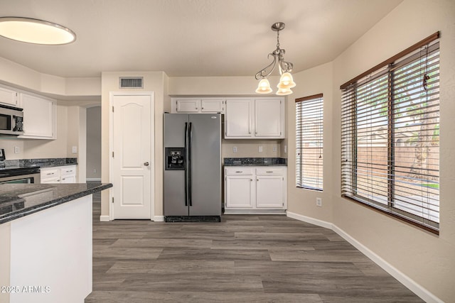 1655 W Stanford Ave, Gilbert, AZ 85233 - kitchen featuring stainless steel appliances, dark wood-type flooring, white cabinets, hanging light fixtures, and baseboards