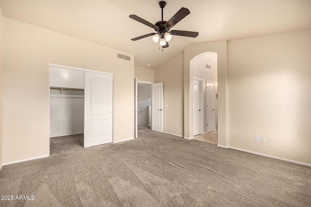 1655 W Stanford Ave, Gilbert, AZ 85233 - unfurnished bedroom featuring carpet flooring, vaulted ceiling, arched walkways, a closet, and baseboards