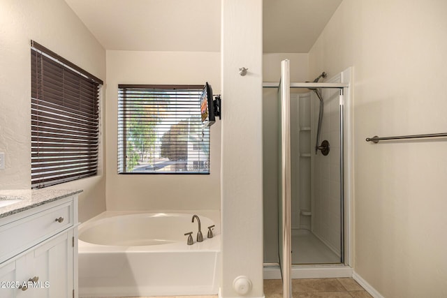 1655 W Stanford Ave, Gilbert, AZ 85233 - bathroom featuring a shower stall, a bath, vanity, tile patterned floors, and baseboards