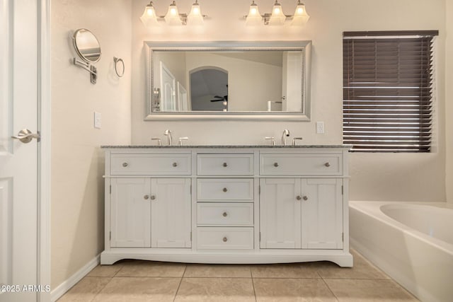1655 W Stanford Ave, Gilbert, AZ 85233 - bathroom featuring tile patterned floors, double vanity, and a bath