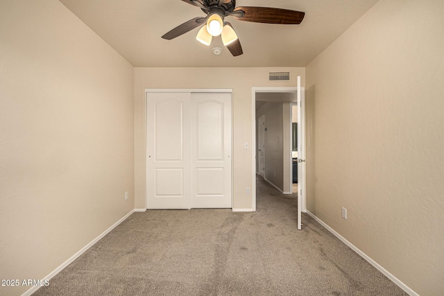 1655 W Stanford Ave, Gilbert, AZ 85233 - unfurnished bedroom featuring carpet, a closet, baseboards, and a ceiling fan