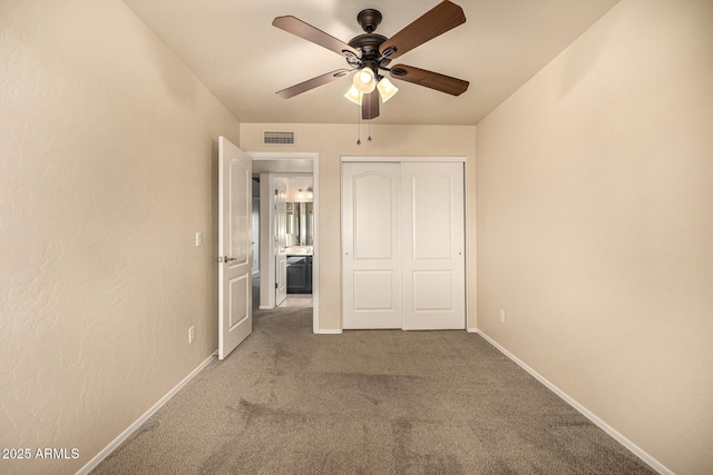 1655 W Stanford Ave, Gilbert, AZ 85233 - unfurnished bedroom with carpet, baseboards, a closet, and a ceiling fan