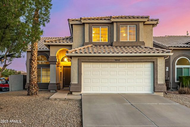 1655 W Stanford Ave, Gilbert, AZ 85233 - mediterranean / spanish house featuring driveway, an attached garage, a tile roof, and stucco siding