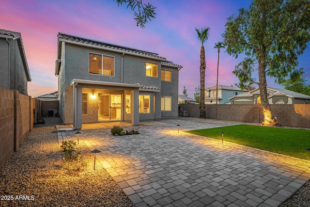 1655 W Stanford Ave, Gilbert, AZ 85233 - back of property featuring a patio, a tiled roof, central AC, solar panels, and stucco siding