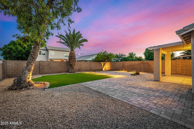1655 W Stanford Ave, Gilbert, AZ 85233 - yard at dusk with a patio area
