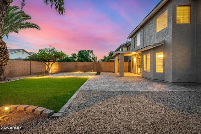 1655 W Stanford Ave, Gilbert, AZ 85233 - yard at dusk with a patio area