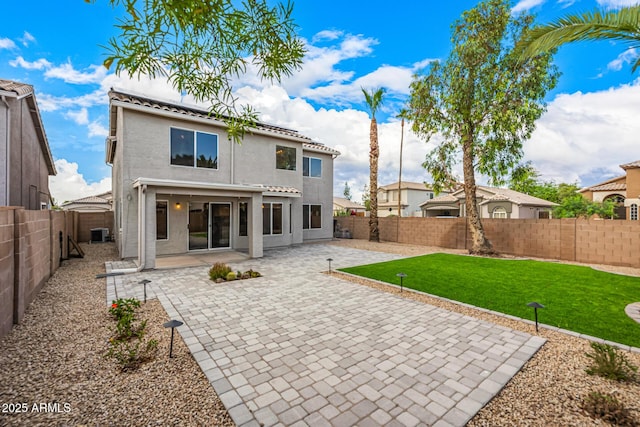 1655 W Stanford Ave, Gilbert, AZ 85233 - rear view of house with roof mounted solar panels, a patio, central AC unit, and stucco siding