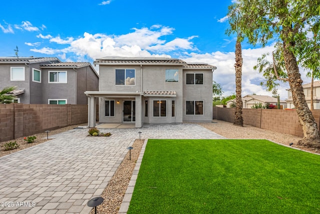 1655 W Stanford Ave, Gilbert, AZ 85233 - back of house featuring a patio, solar panels, stucco siding, and a tiled roof