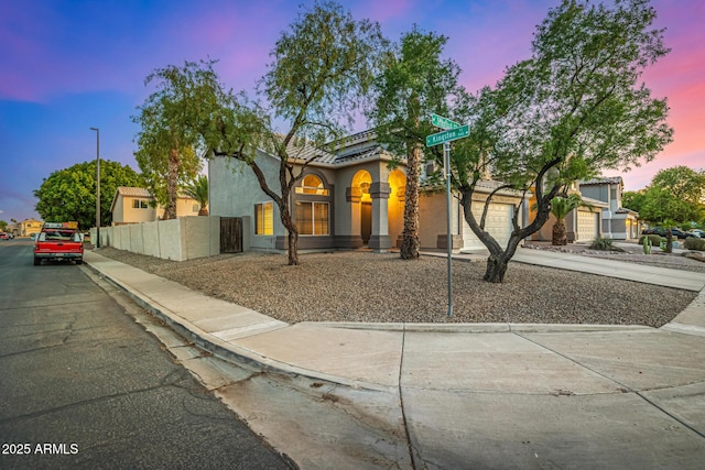 1655 W Stanford Ave, Gilbert, AZ 85233 - mediterranean / spanish-style home with driveway, stucco siding, and an attached garage