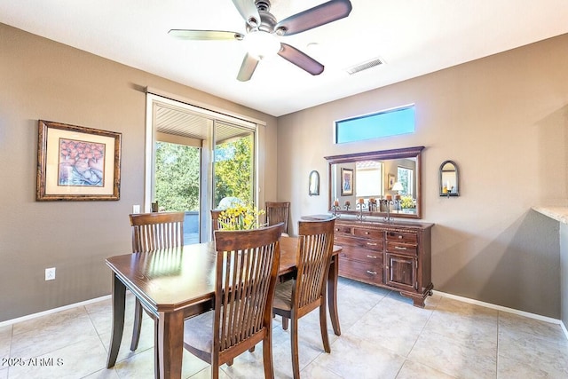 dining space with ceiling fan