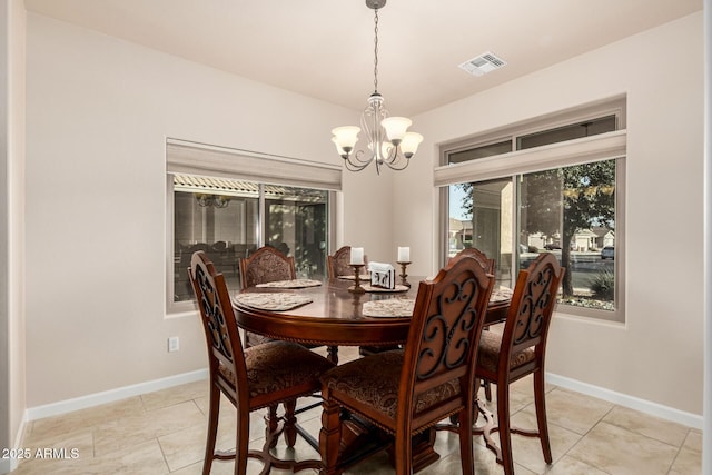 dining room featuring baseboards, visible vents, a notable chandelier, and light tile patterned flooring