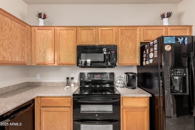 kitchen with black appliances and light countertops