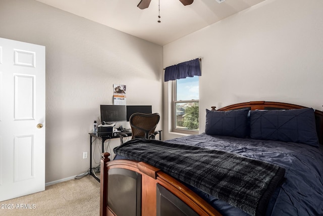 bedroom with light carpet, ceiling fan, and baseboards