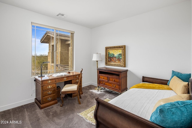 bedroom with dark carpet