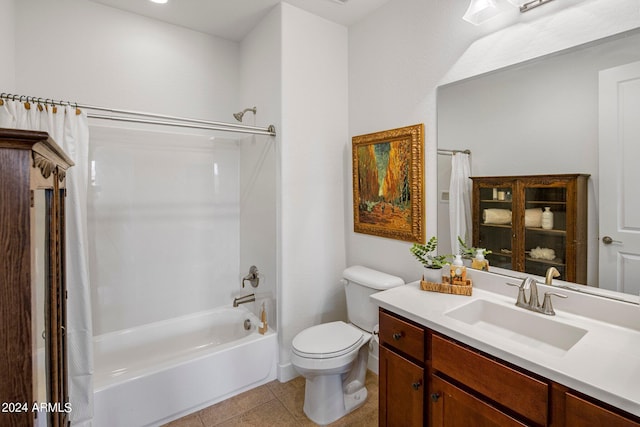 full bathroom with shower / tub combo with curtain, vanity, tile patterned flooring, and toilet