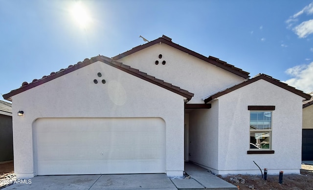 view of front of property with a garage