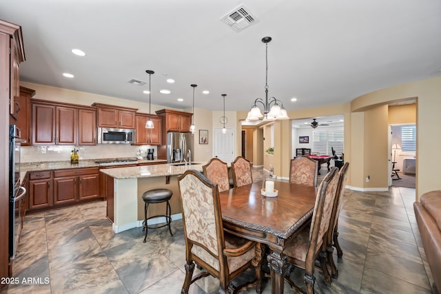 dining room with baseboards, visible vents, and recessed lighting