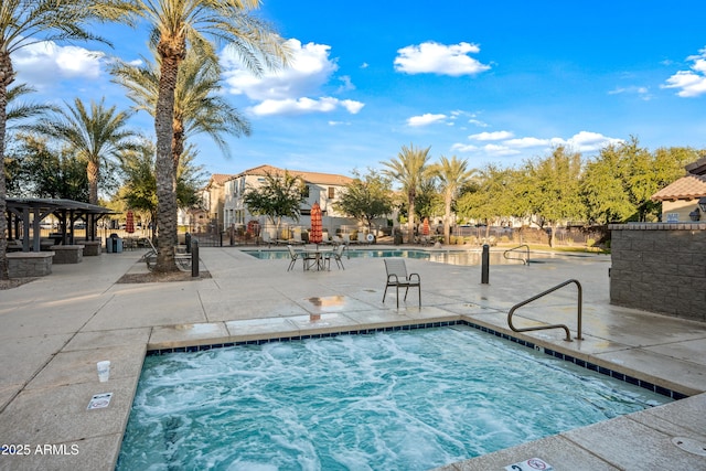 view of swimming pool with fence