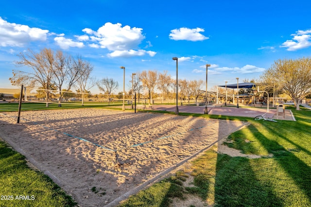 view of home's community with a yard and volleyball court