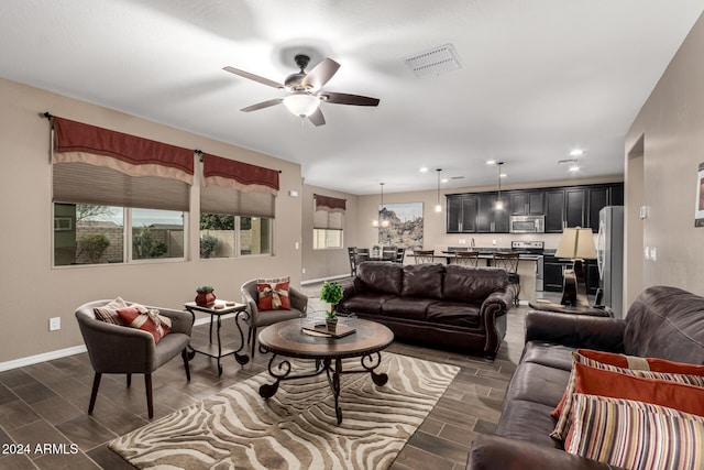 living room featuring ceiling fan