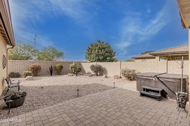 view of patio / terrace featuring a hot tub