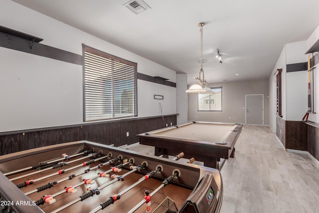 rec room with light hardwood / wood-style floors and billiards