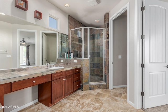 bathroom with ceiling fan, vanity, and walk in shower