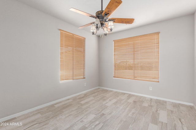 empty room featuring ceiling fan and light wood-type flooring