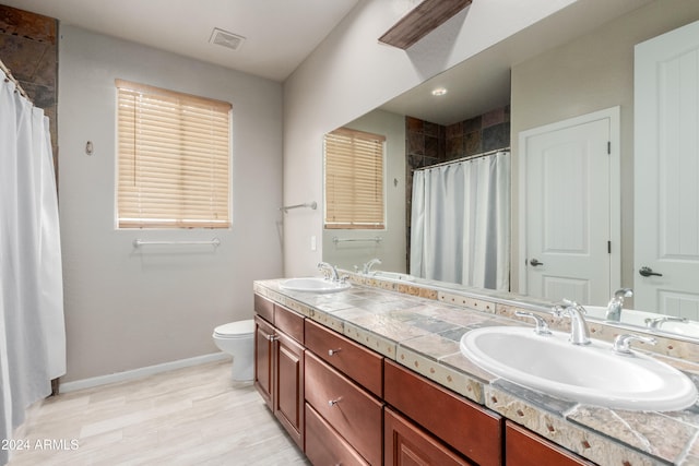 bathroom featuring hardwood / wood-style flooring, vanity, toilet, and a shower with shower curtain