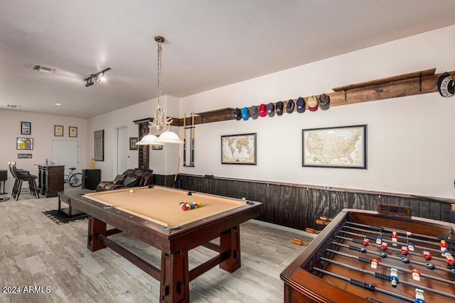 rec room featuring wood walls, light hardwood / wood-style floors, and billiards