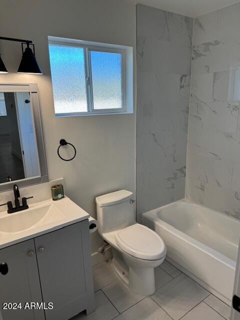 full bathroom featuring tile patterned floors, vanity, tiled shower / bath combo, and toilet