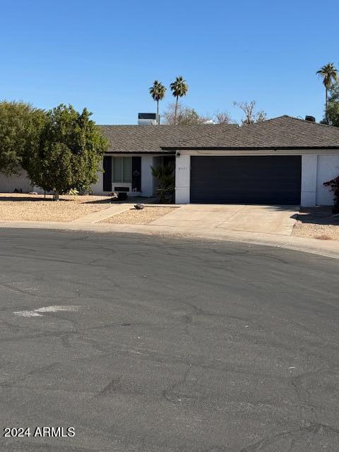 ranch-style house featuring a garage