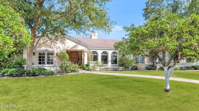 view of front of house with a front lawn