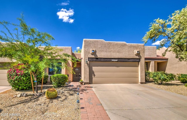 southwest-style home featuring a garage