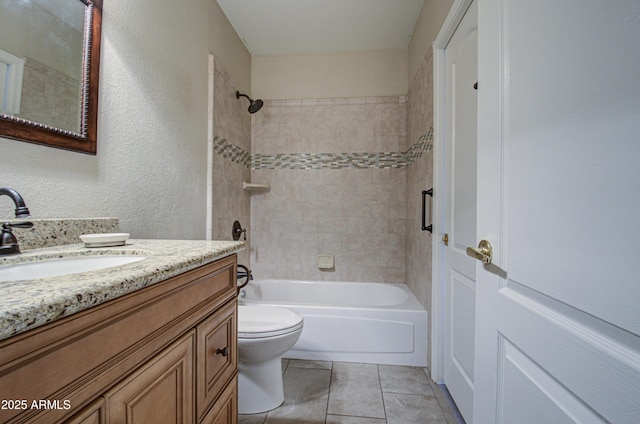 full bathroom featuring tiled shower / bath combo, toilet, tile patterned flooring, and vanity