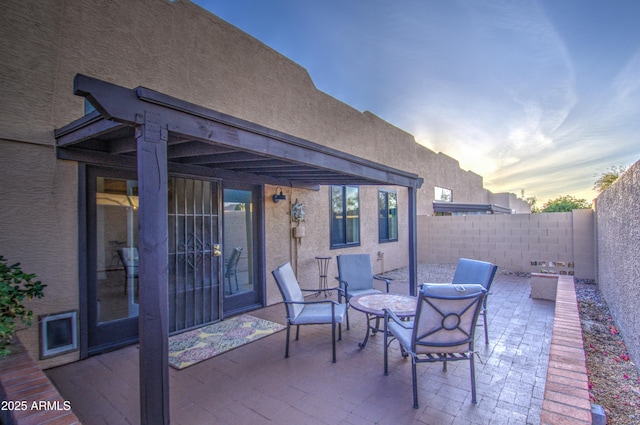 11772 E Clinton St, Scottsdale, AZ 85259 - patio terrace at dusk with a patio and a fenced backyard