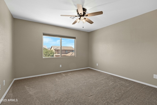 spare room with carpet flooring and ceiling fan