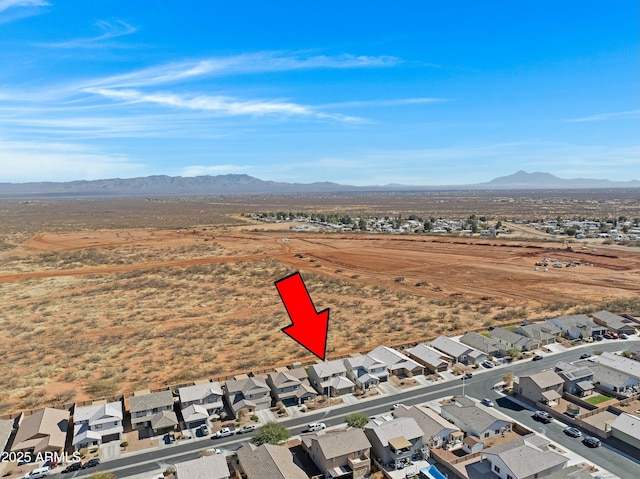 birds eye view of property featuring a mountain view