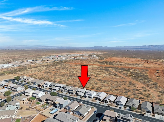 drone / aerial view featuring a mountain view