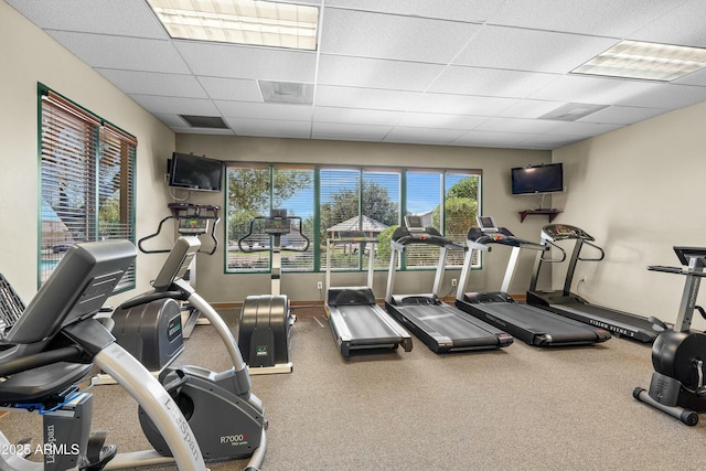 exercise room with a paneled ceiling